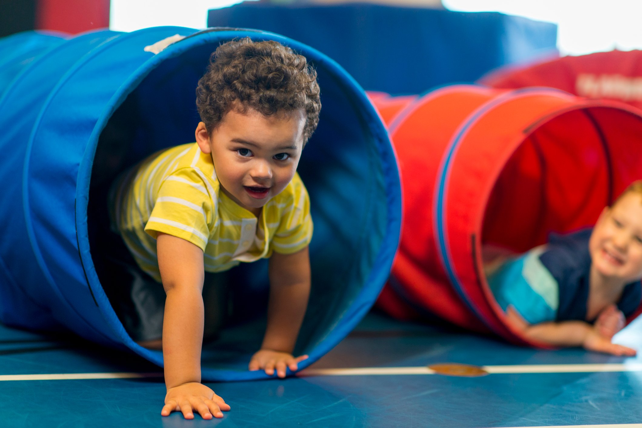 Diverse group of toddlers playing together.